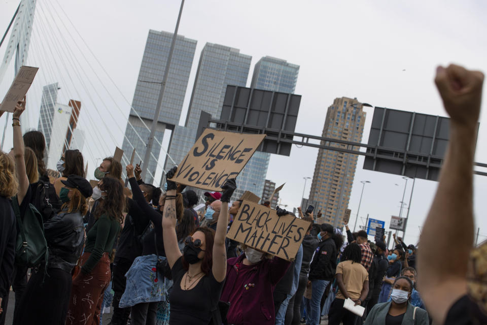 Thousands of people take part in a demonstration in Rotterdam, Netherlands, Wednesday, June 3, 2020, to protest against the recent killing of George Floyd, police violence and institutionalized racism. Floyd, a black man, died in police custody in Minneapolis, U.S.A., after being restrained by police officers on May 25, 2020. (AP Photo/Peter Dejong)