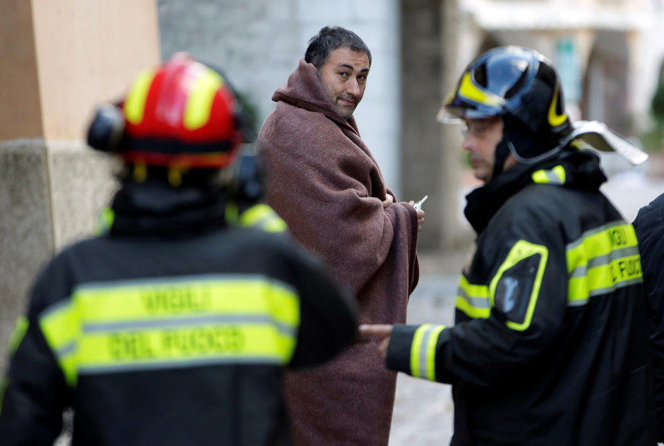 A man covers himself with a blanket