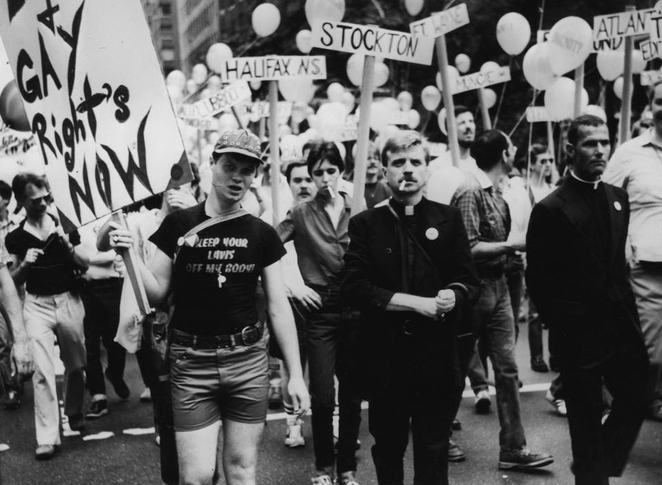 A crowd of gay rights protesters, including two priests, marching in the New York Gay Day Parade.   (Photo by Peter Keegan/Getty Images)