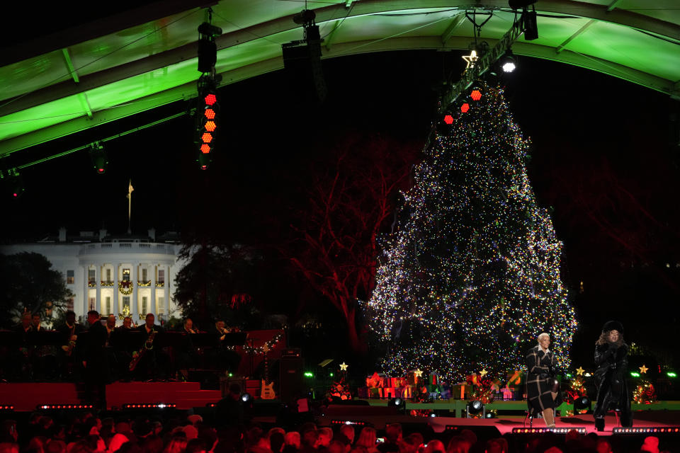 With the White House in the background, Dionne Warwick and Ledisi perform after President Joe Biden and first lady Jill Biden lit the National Christmas Tree on the Ellipse, near the White House in Washington, Thursday, Nov. 30, 2023. (AP Photo/Mark Schiefelbein)