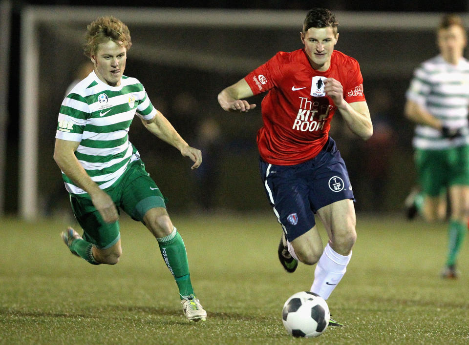HOBART, AUSTRALIA - AUGUST 05:  Andy Brennan (R) of South Hobart controls the ball during the FFA Cup match between South Hobart and Tuggeranong at KGV Park on August 5, 2014 in Hobart, Australia.  (Photo by Robert Prezioso/Getty Images)