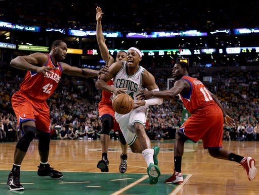 Philadelphia 76ers' Elton Brand (L) and Jrue Holiday (R) defends as Boston Celtics' Paul Pierce (2nd R) heads for the net during game two of the NBA Eastern Conference series on May 14. Philadelphia held on for a 82-81 win over Boston to even their Eastern Conference playoff series at 1-1