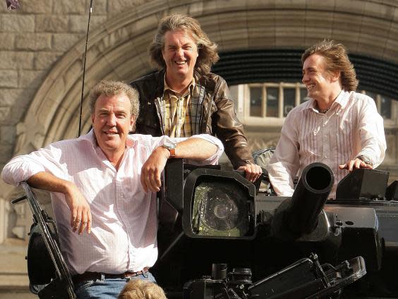 Clarkson, May and Hammond riding a tank (Getty)