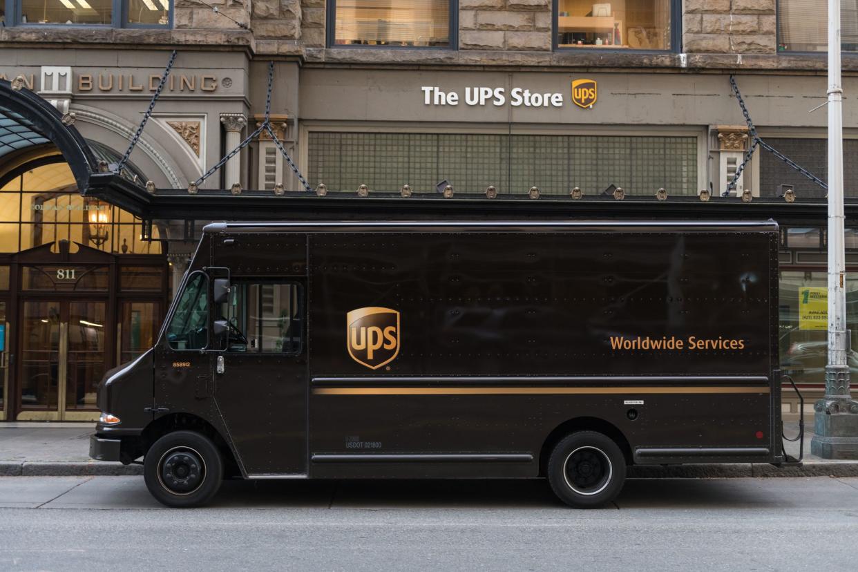Seattle, USA - Jan 2nd 2021: UPS Truck at the UPS Store on 1st ave in Downtown Seattle late in the day.
