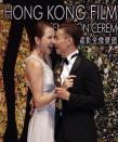 Chinese actor Zhang Jin and his wife actress Ada Choi react backstage after he won Best Supporting Actor for his role in the movie "The Grandmaster" at the 33rd Hong Kong Film Awards in Hong Kong April 13, 2014. REUTERS/Bobby Yip (CHINA - Tags: ENTERTAINMENT)