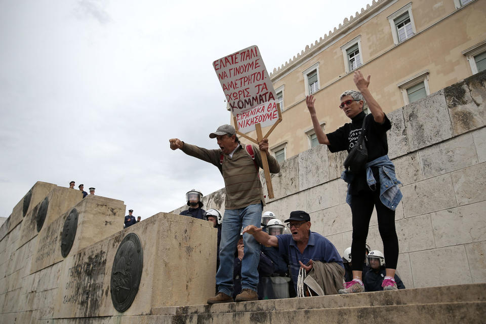 <p>Protesters stand on the stairs leading to the parliament as riot police block the way, during a demonstration marking a 24-hour general strike against the latest round of austerity Greece has agreed with its lenders, in Athens, Greece, May 17, 2017. (Costas Baltas/Reuters) </p>