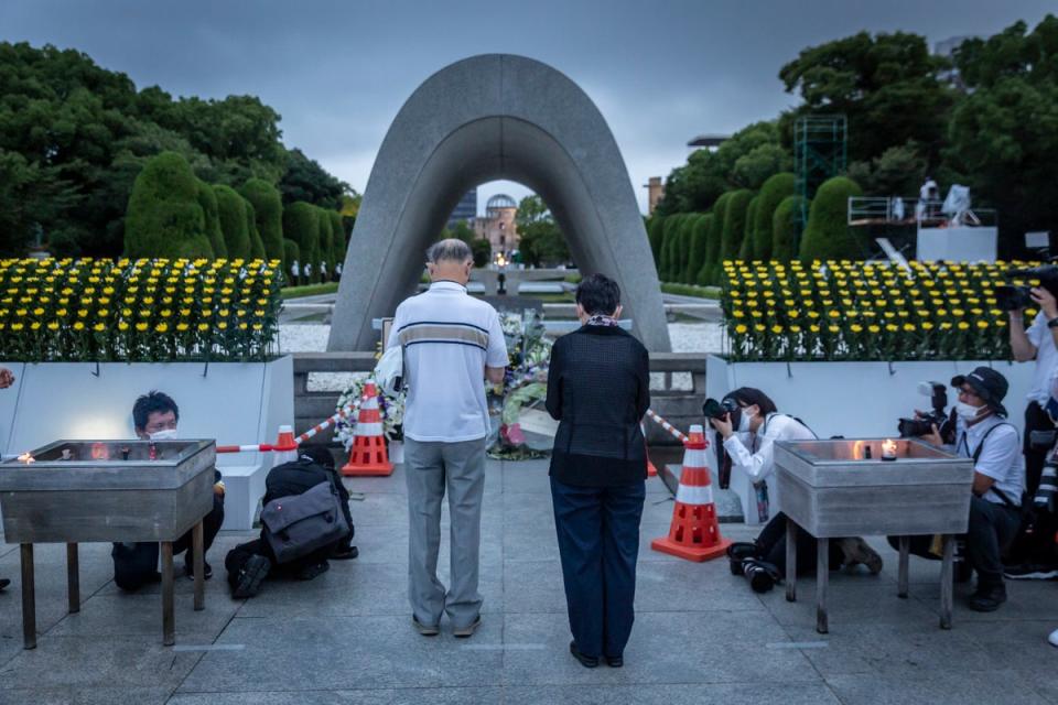 People pray in remembrance of the Hiroshima atomic bombing. 6 August 2022 marks the 77th anniversary of the atomic bombing of Hiroshima during the Second World War in which between 90,000-146,000 people were killed and the entire city destroyed in the first use of a nuclear weapon in armed conflict (Getty Images)