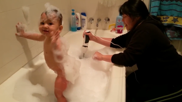 A mum using an electric mixer to make bubbles in a bath for her baby has sparked debate online.