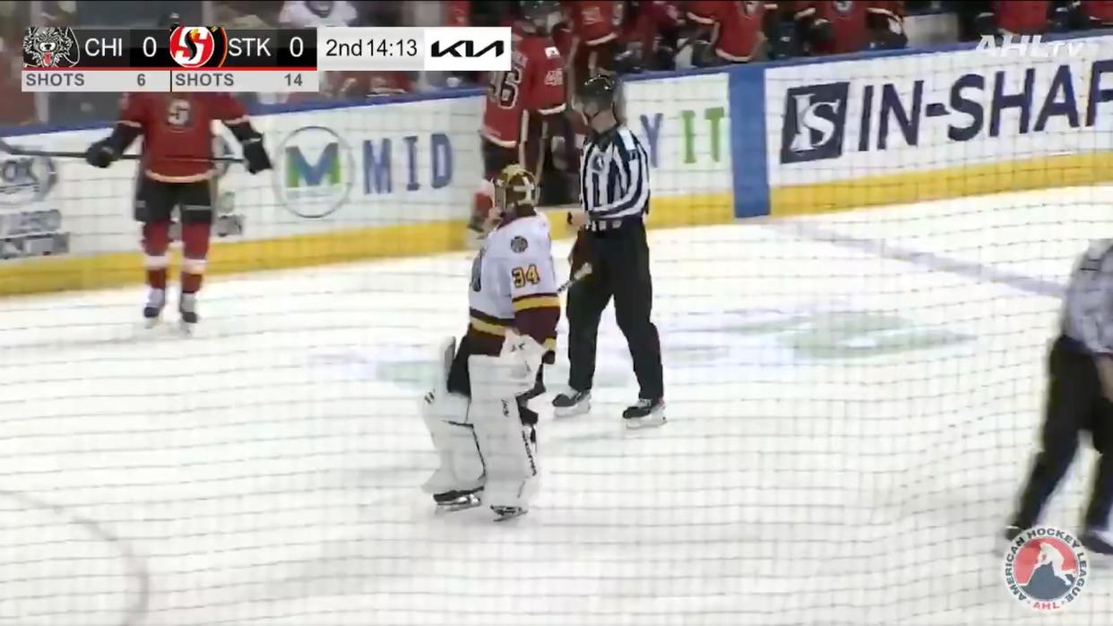 Alex Lyon of the Chicago Wolves challenged the Stockton Heat's bench after he was run over by forward Martin Pospisil during the Wolves' 3-0 win. (AHL.TV)