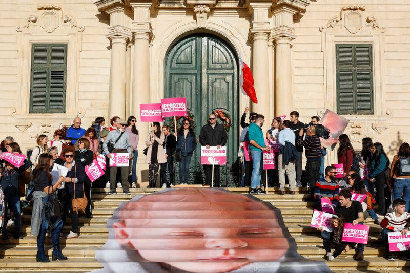 People protest against government plans to introduce an abortion law in Valletta