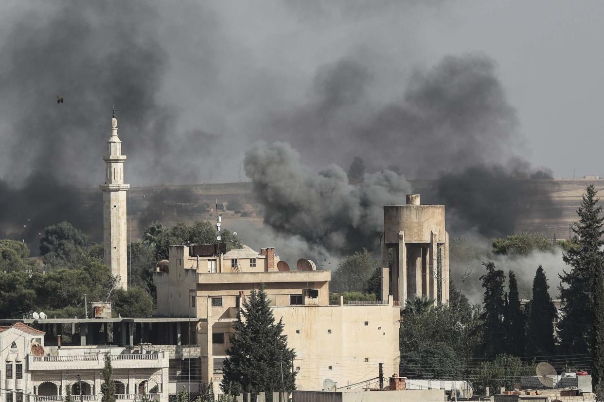 Smoke rises over the Syrian town of Ras al-Ain: Getty Images