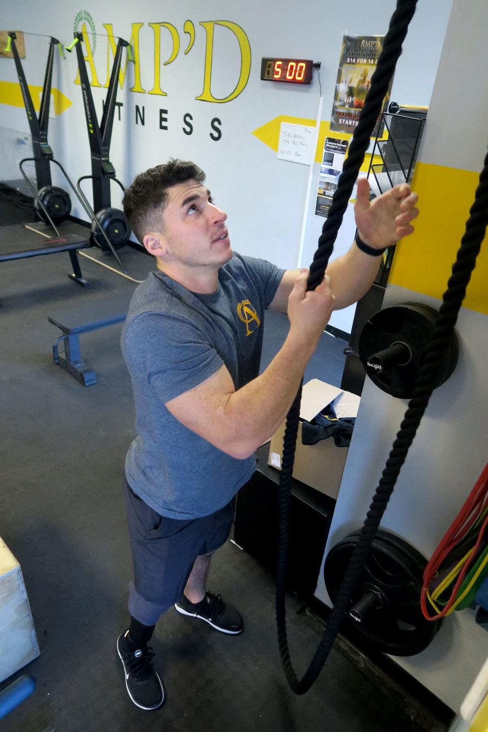 AMP'D Fitness owner Max Gomez demonstrates one of the machines in the Brielle fitness studio Monday, December 5, 2022.  The nearly two-year-old gym with locations in Manasquan and Brielle specializes in personalized strength training for adults ages 30 and over.