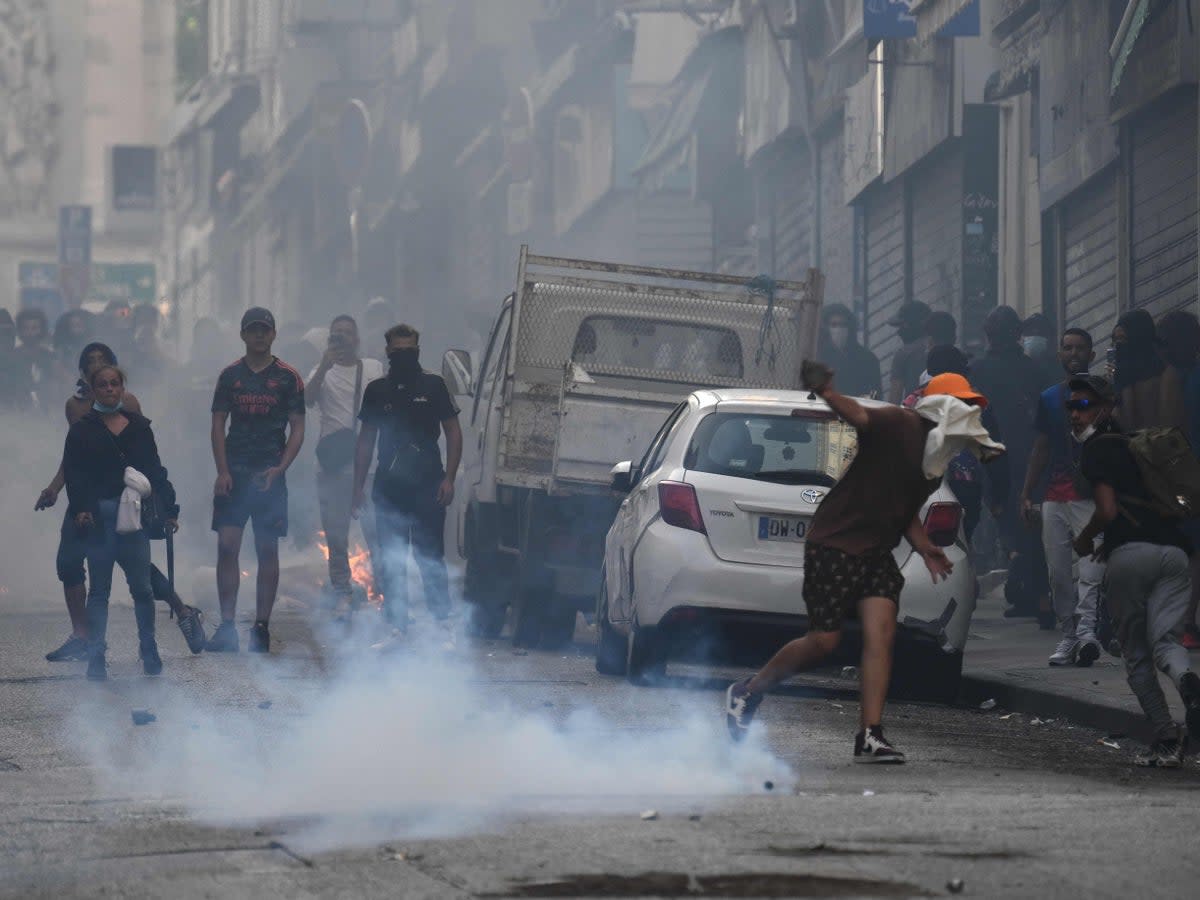 Protesters clash with riot police in Marseille (AFP via Getty Images)