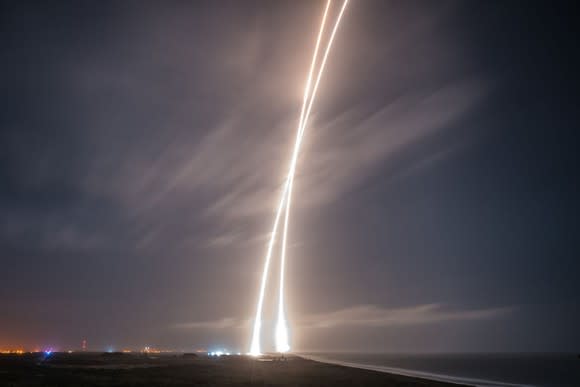 Time lapse photo showing rocket trails rising and descending