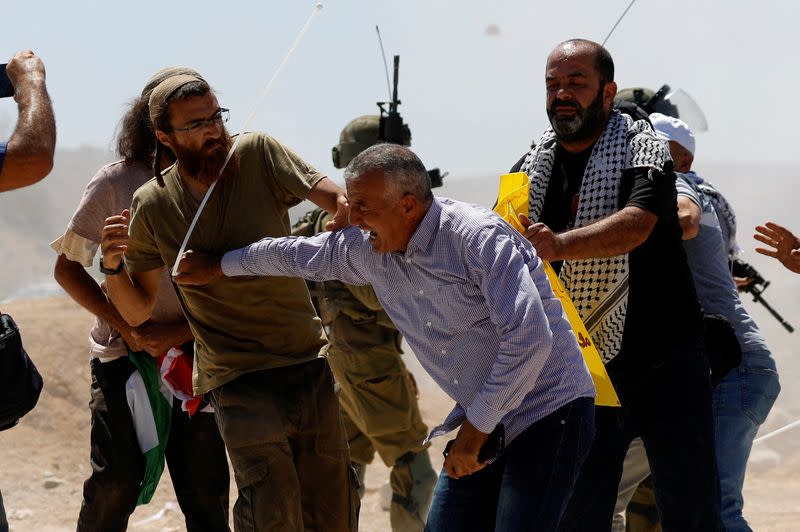 Palestinians protest against Israeli settlement activity in Al Mughayyir village