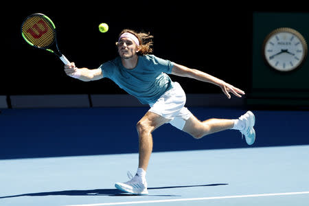 Tennis - Australian Open - Quarter-final - Melbourne Park, Melbourne, Australia, January 22, 2019. Greece’s Stefanos Tsitsipas in action with Spain’s Roberto Bautista Agut. REUTERS/Adnan Abidi