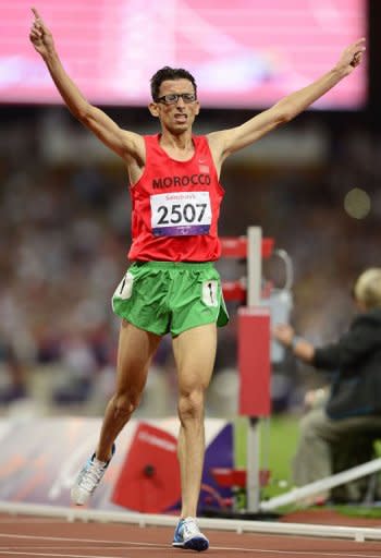 Marocco's El Amin Chentouf crosses the finish line to break the world record in the men's 5000m T12 at the Paralympic Games on September 3, 2012