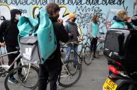 Deliveroo riders demonstrate to push for improved working conditions, in London