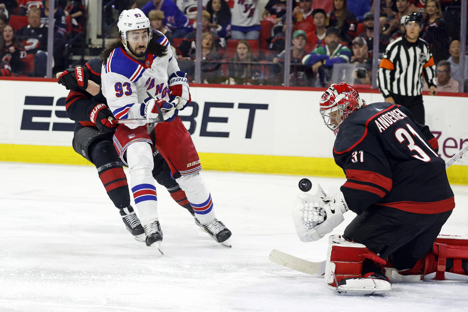New York Rangers' Mika Zibanejad (93) has his shot snared by Carolina Hurricanes goaltender Frederik Andersen (31) during the first period in Game 4 of an NHL hockey Stanley Cup second-round playoff series in Raleigh, N.C., Saturday, May 11, 2024. (AP Photo/Karl B DeBlaker)