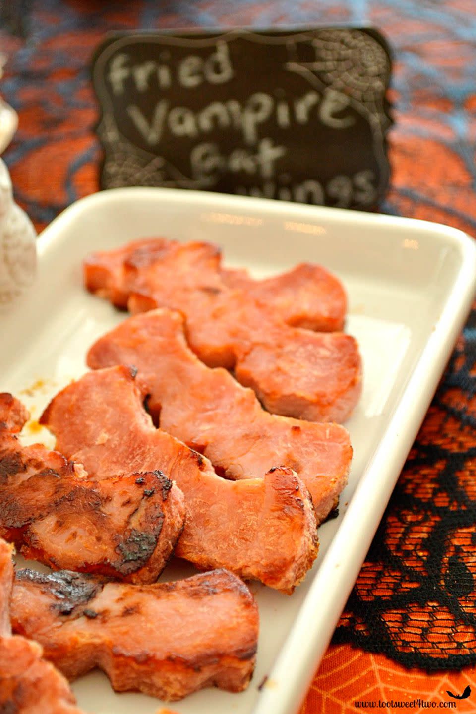 <p>Heat up these bat-shaped ham steaks and you've got yourself one <a rel="nofollow noopener" href="https://www.womansday.com/food-recipes/g2574/easy-halloween-appetizers/" target="_blank" data-ylk="slk:spooky appetizer;elm:context_link;itc:0;sec:content-canvas" class="link ">spooky appetizer</a>.</p><p><strong>Get the recipe at <a rel="nofollow noopener" href="http://www.tootsweet4two.com/fried-vampire-bat-wings/" target="_blank" data-ylk="slk:Toot Sweet 4 Two;elm:context_link;itc:0;sec:content-canvas" class="link ">Toot Sweet 4 Two</a>. </strong><br></p><p><strong>Tools you'll need: </strong>bat-shaped cookie cutter ($6, <a rel="nofollow noopener" href="https://www.amazon.com/Fox-Run-Bat-Cookie-Cutter/dp/B0000VLONG" target="_blank" data-ylk="slk:amazon.com;elm:context_link;itc:0;sec:content-canvas" class="link ">amazon.com</a>)</p>