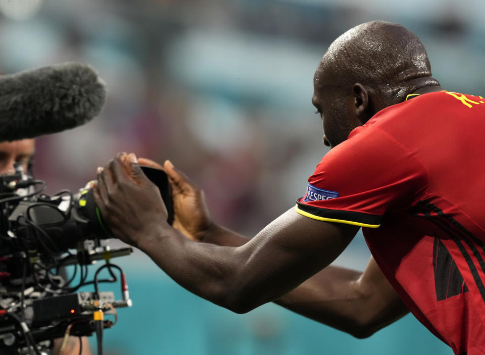 Belgium's Romelu Lukaku celebrates after scoring his sides first goal during the Euro 2020 soccer championship group B match between Russia and Belgium at the Saint Petersburg stadium in St. Petersburg, Russia, Saturday, June 12, 2021. (AP Photo/Dmitry Lovetsky, Pool)