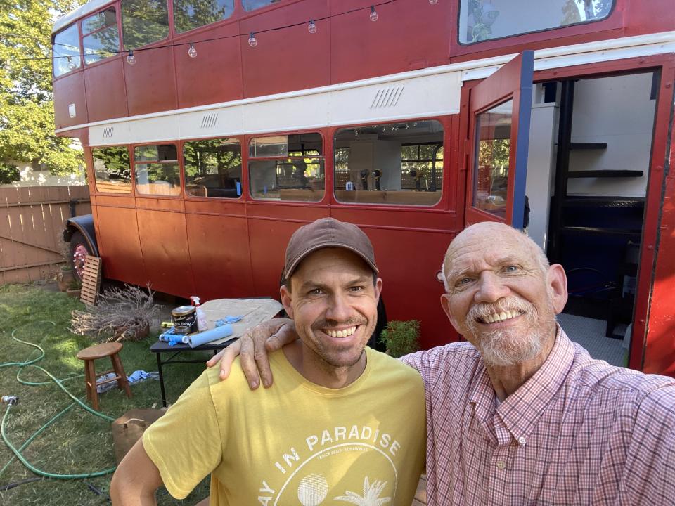 Scott and his father standing outside the bus