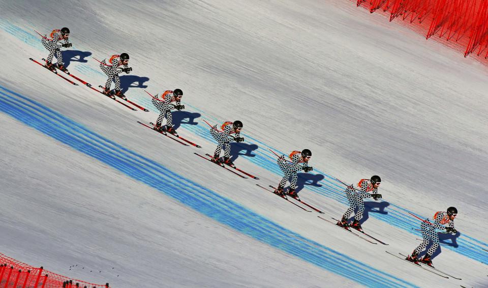 Argentina's Cristian Javier Simari Birkner speeds down the course during the downhill run of the men's alpine skiing super combined training session at the Sochi 2014 Winter Olympics at the Rosa Khutor Alpine Center February 13, 2014. Picture taken with multiple exposure function. REUTERS/Dominic Ebenbichler