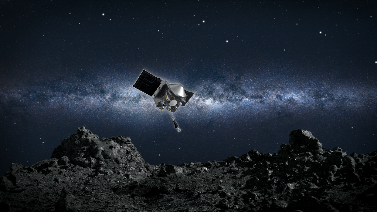  An artist's depiction of the OSIRIS-REx spacecraft collecting a sample from asteroid Bennu. 