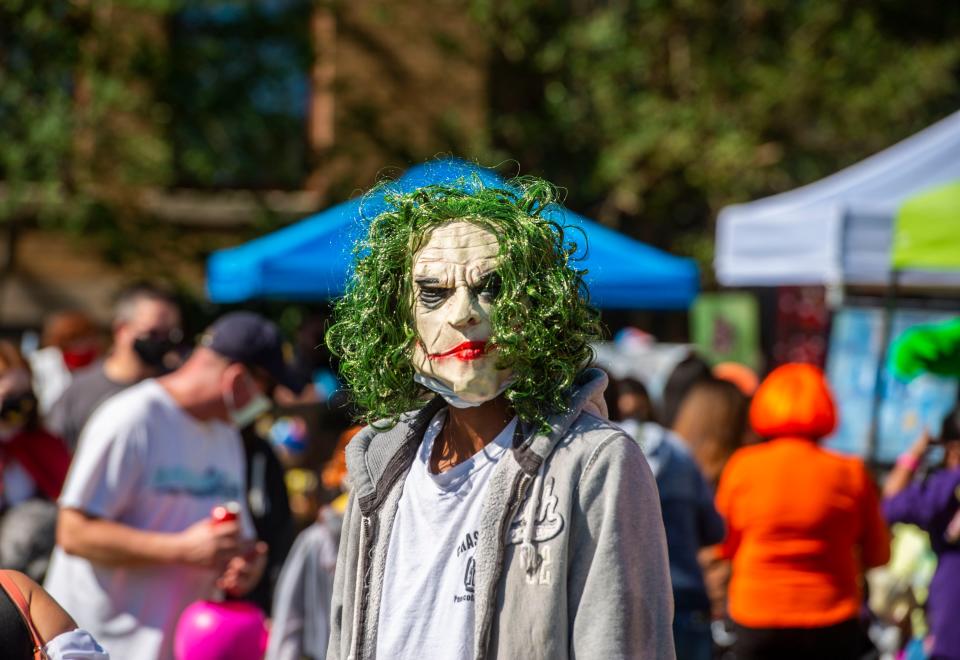 The Joker wanders around Pensacon HalloweenFest Saturday, October 31, 2020 at Museum Plaza in downtown Pensacola. Offering an outdoor, convention-style atmosphere with a Halloween theme, the day features vendors, live entertainment, celebrity guests, artists, panels, food trucks and trick-or-treating.