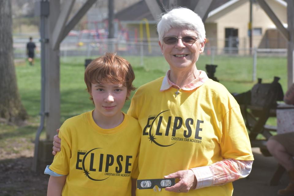 Sue Feasel watched the eclipse with one of her students, Cody, 11.