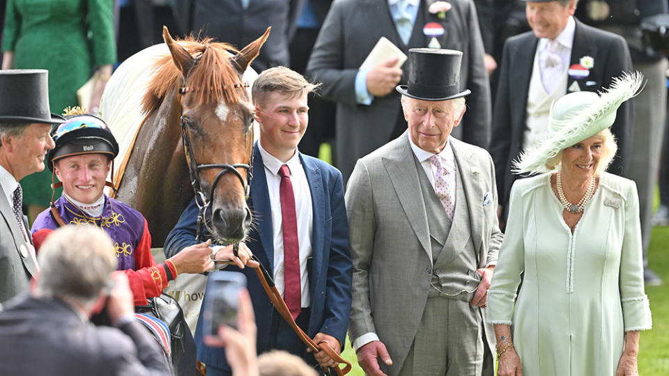 ASCOT, ENGLAND - JUNE 22: Desert Hero ridden by Tom Marquand with owners the King Charles III and Queen Camilla after The King George V Stakes at day three of Royal Ascot 2023 at Ascot Racecourse on June 22, 2023 in Ascot, England. (Photo by Samir Hussein/WireImage)