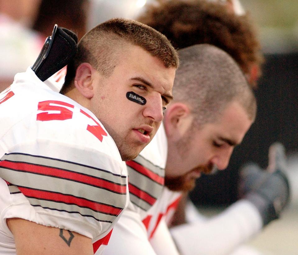 Ohio State's Mike Kudla (57) sits on the bench during the final minutes of his team's loss to Iowa in an NCAA college football game in Iowa City, Iowa. The former Ohio State defensive end died Sunday, July 15, 2018, according to Highland Local Schools in Medina, Ohio, the school district where he played in high school. He was 34.
