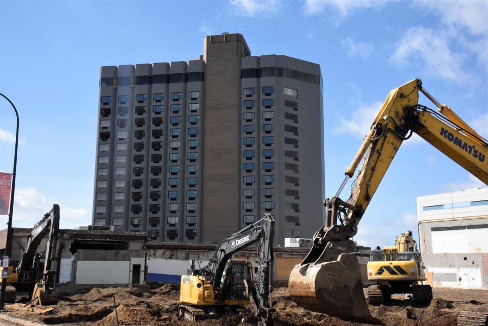 Excavators clear rubble and dirt at the site of the former McCamly Plaza atrium in front of the former McCamly Hotel on Thursday, June 16, 2022, in Battle Creek. The work is part of a $59 million renovation of the property.