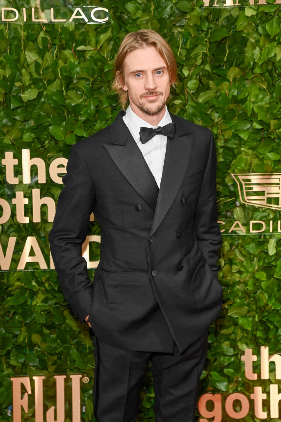 Boyd in a double-breasted suit and bow tie on the red carpet