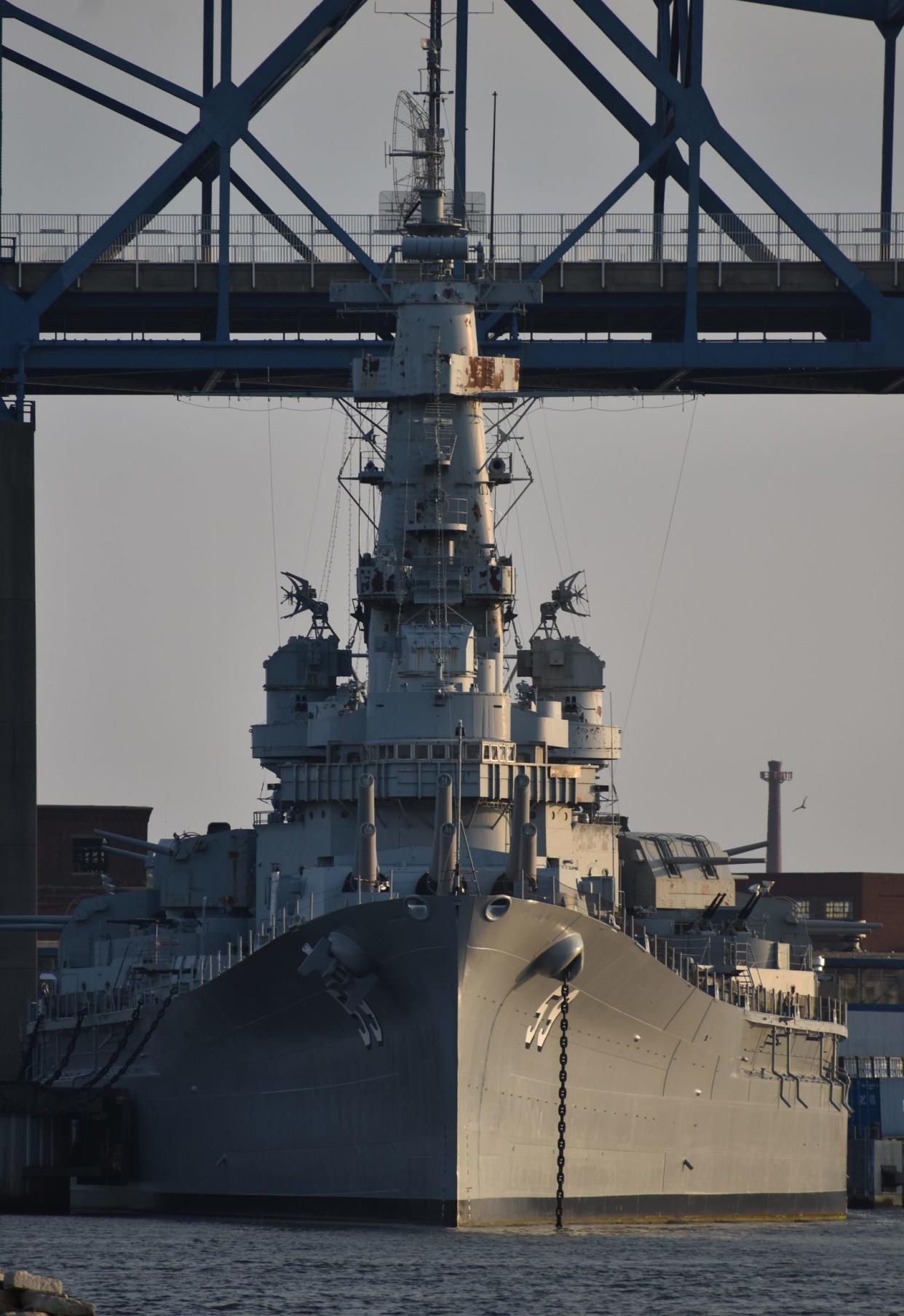 Battleship Cove is among the tourism assets in Fall River. Here, Big Mamie, as Battleship Massachusetts is known locally, is seen in front of the Braga Bridge.