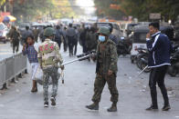 A soldiers holds a long firearm during a crackdown on anti-coup protesters holding a rally in front of the Myanmar Economic Bank in Mandalay, Myanmar on Monday, Feb. 15, 2021. Security forces in Myanmar intensified their crackdown against anti-coup protesters on Monday, seeking to quell the large-scale demonstrations calling for the military junta that seized power earlier this month to reinstate the elected government. (AP Photo)