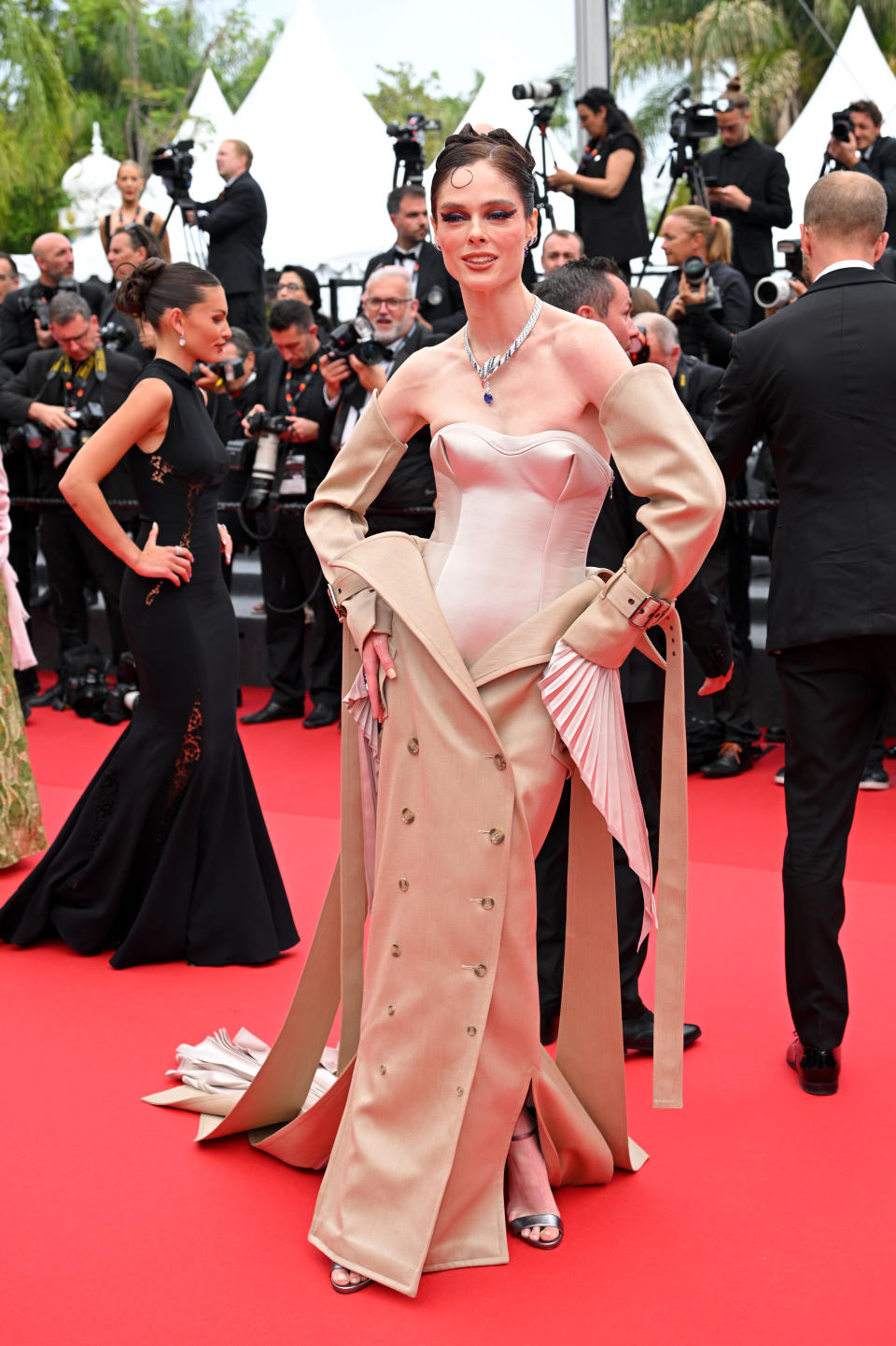 Rocha attends the "The Apprentice" Red Carpet at the 77th annual Cannes Film Festival at Palais des Festivals wearing strappy stilettos