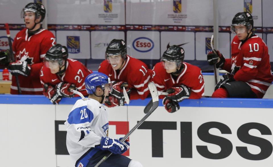 Finland's Teuvo Teravainen celebrates in front of Canada's bench after scoring on a penalty shot during the third period of their IIHF World Junior Championship ice hockey game in Malmo, Sweden, January 4, 2014. REUTERS/Alexander Demianchuk (SWEDEN - Tags: SPORT ICE HOCKEY)