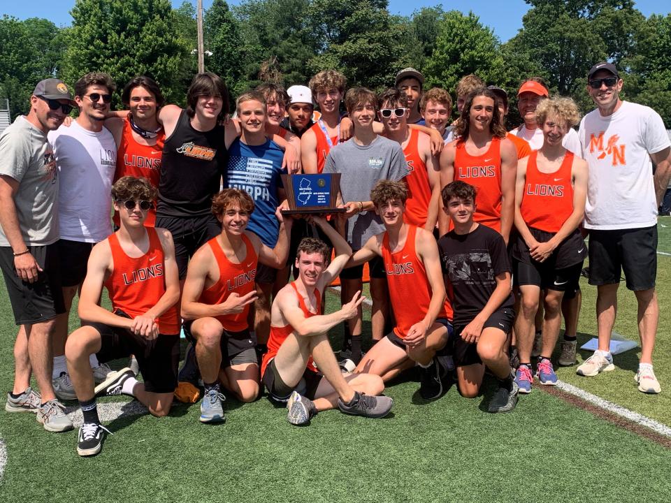 The Middletown North boys track team with the Central Group 3 trophy