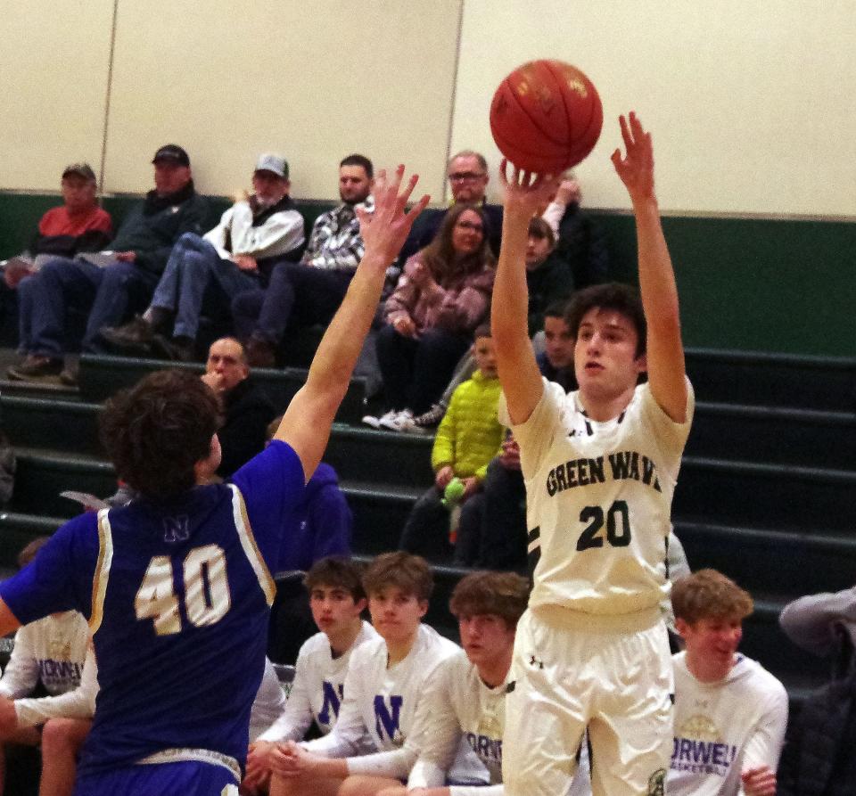 Abington's #20 (R) Tyler Staiti launches a shot against Norwell's Jackson Adams in 1st half action on Wednesday, Jan. 31, 2024.