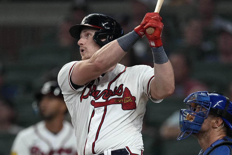 Atlanta Braves' Sean Murphy hits a flyball in the eighth inning of a baseball game against the Chicago Cubs, Tuesday, Sept. 26, 2023, in Atlanta. Chicago Cubs right fielder Seiya Suzuki misplayed allowing two runs to score. (AP Photo/John Bazemore)