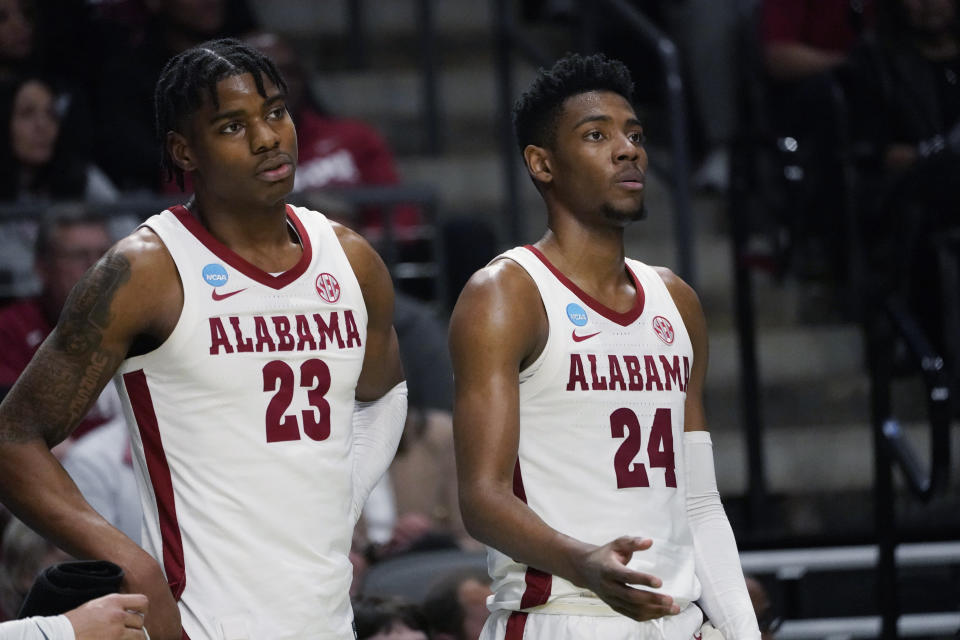 Alabama forwards Nick Pringle (23) Brandon Miller (24) stand by the bench in the second half of the team's first-round college basketball game against Texas A&M-Corpus Christi in the men's NCAA Tournament in Birmingham, Ala., Thursday, March 16, 2023. Alabama won 96-75. (AP Photo/Rogelio V. Solis)