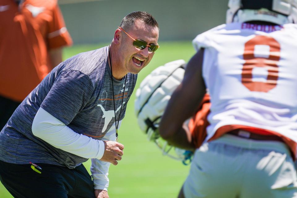 Longhorns coach Steve Sarkisian instructs his team during its first preseason practices at the Frank Denius Fields on the University of Texas campus Wednesday.