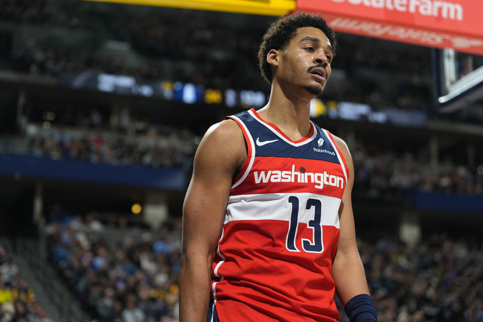 Washington Wizards guard Jordan Poole reacts after being fouled while driving to the basket in the first half of an NBA basketball game against the Denver Nuggets Thursday, Feb. 22, 2024, in Denver. (AP Photo/David Zalubowski)