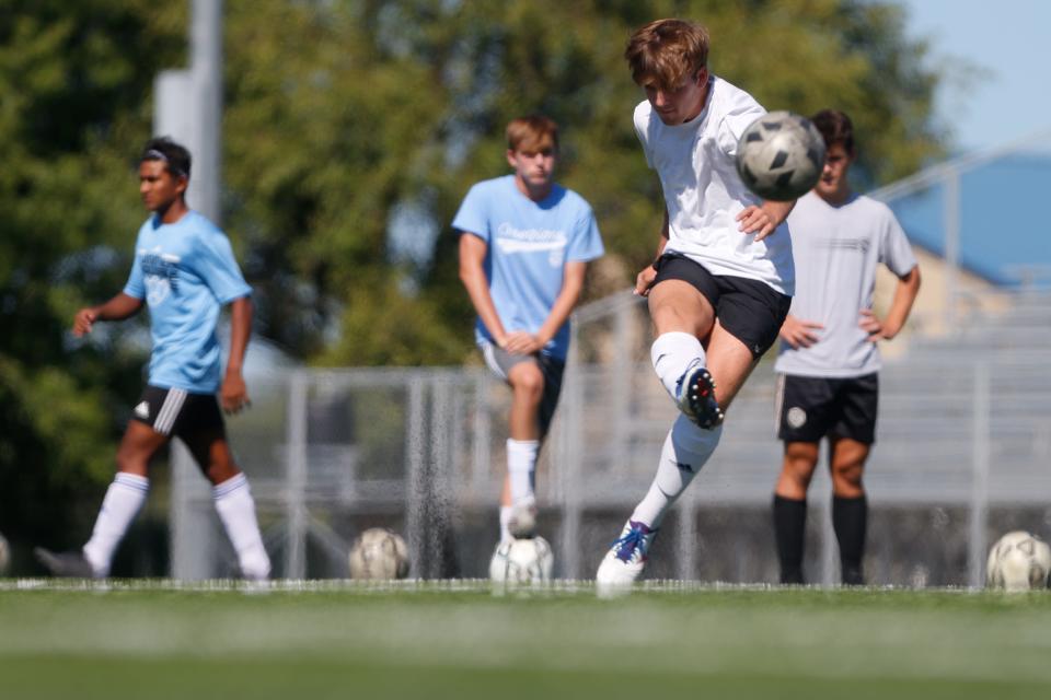 Mason Grogan, senior defender, fires a shot during the team's practice Wednesday afternoon.