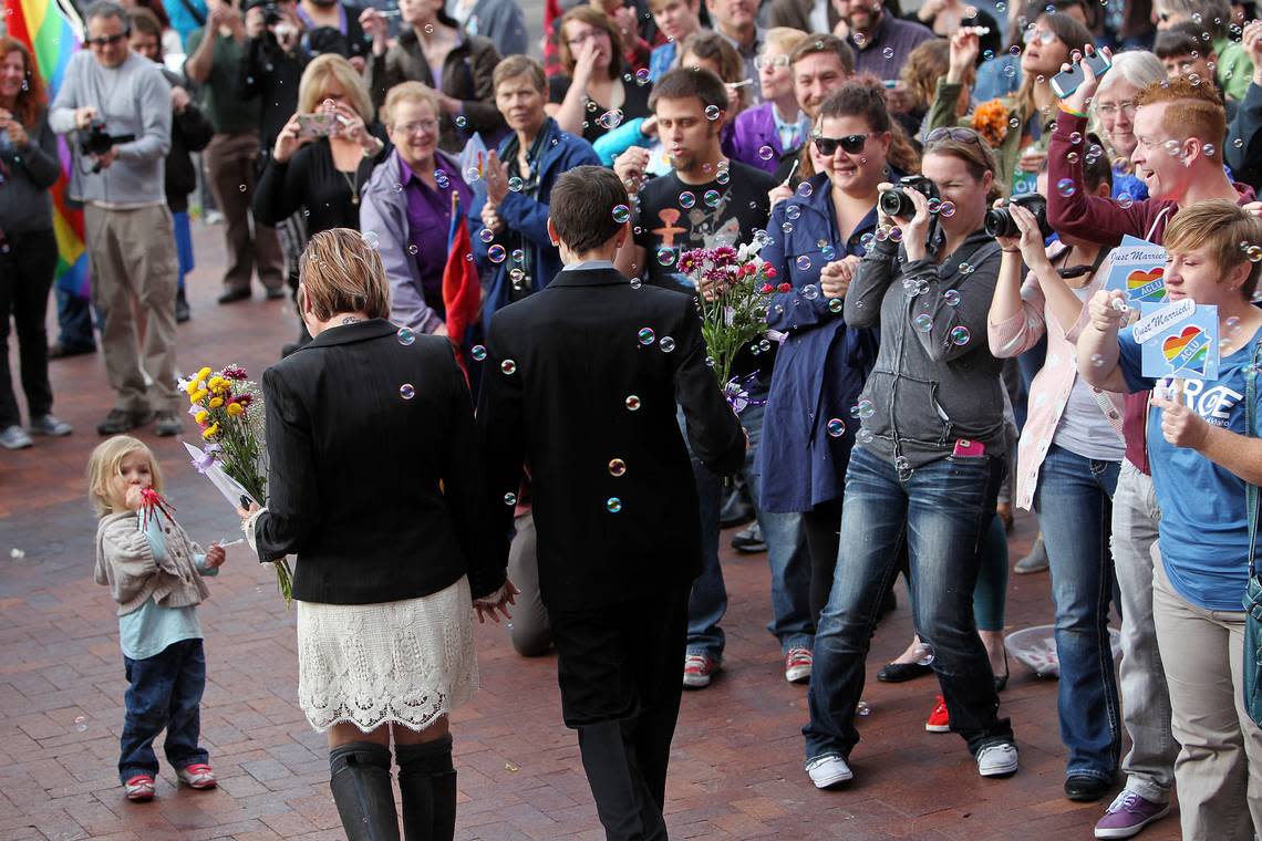 Well wishers blow bubbles and cheer as same-sex couples make their way out of the Ada County Courthouse after receiving their marriage licenses in this file photo from Wednesday, Oct. 15, 2014, after a federal appeals court upheld a lower court’s ruling that overturned Idaho’s ban on same-sex marriages as unconstitutional.