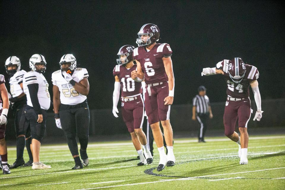 Trent Maloney #6 of First Baptist Academy celebrates a fourth down stop over Moore Haven in the Class 1S-Region 4 championship at FBA Friday, Nov. 24, 2023.