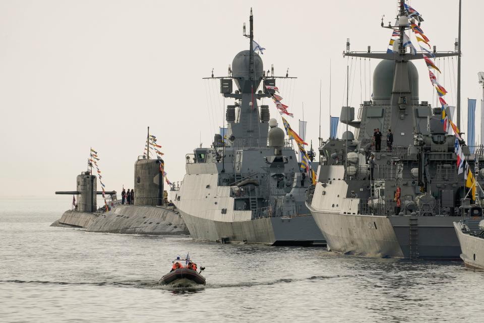 Russian submarines and warships are moored at the St. Petersburg Marine Station closed to receive cruise ships due to the coronavirus pandemic, during the International Maritime Defense show in St. Petersburg, Russia, Friday, June 25, 2021.