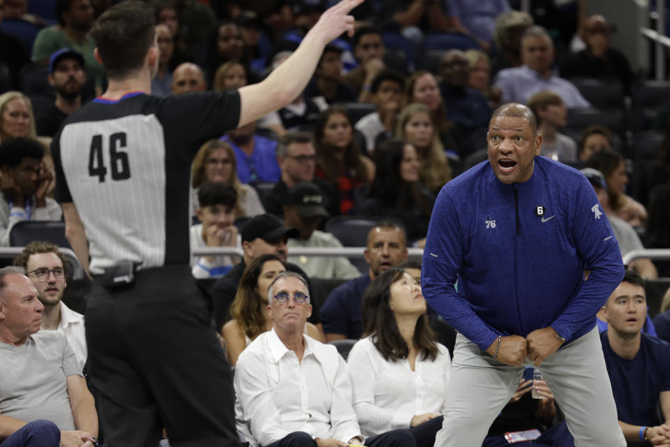 Philadelphia 76ers head coach Doc Rivers, right, yells at official Ben Taylor during the first half of an NBA basketball game against the Orlando Magic, Friday, Nov. 25, 2022, in Orlando, Fla. (AP Photo/Kevin Kolczynski)