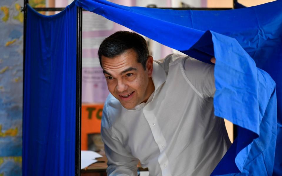 Alexis Tsipras, leader of the main opposition Syriza party, casts his vote at a polling station in Athens, Greece on Sunday - Michael Varaklas